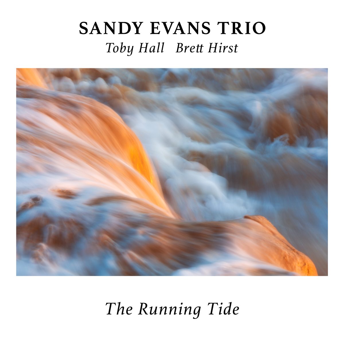 Cover of The Running Tide by the Sandy Evans Trio: orange light on moving water